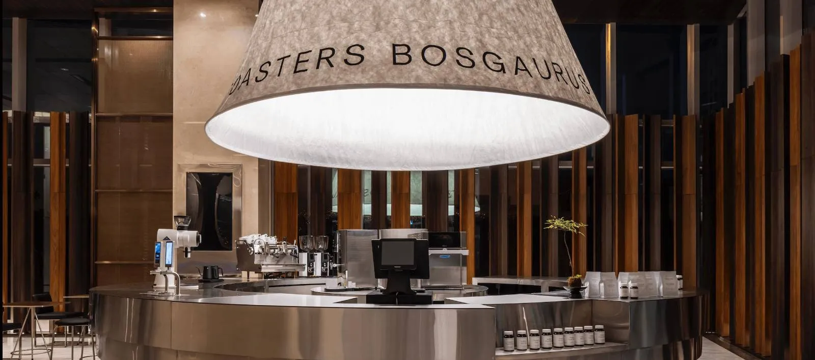 Spacious modern lobby with a prominent reception desk and marble features