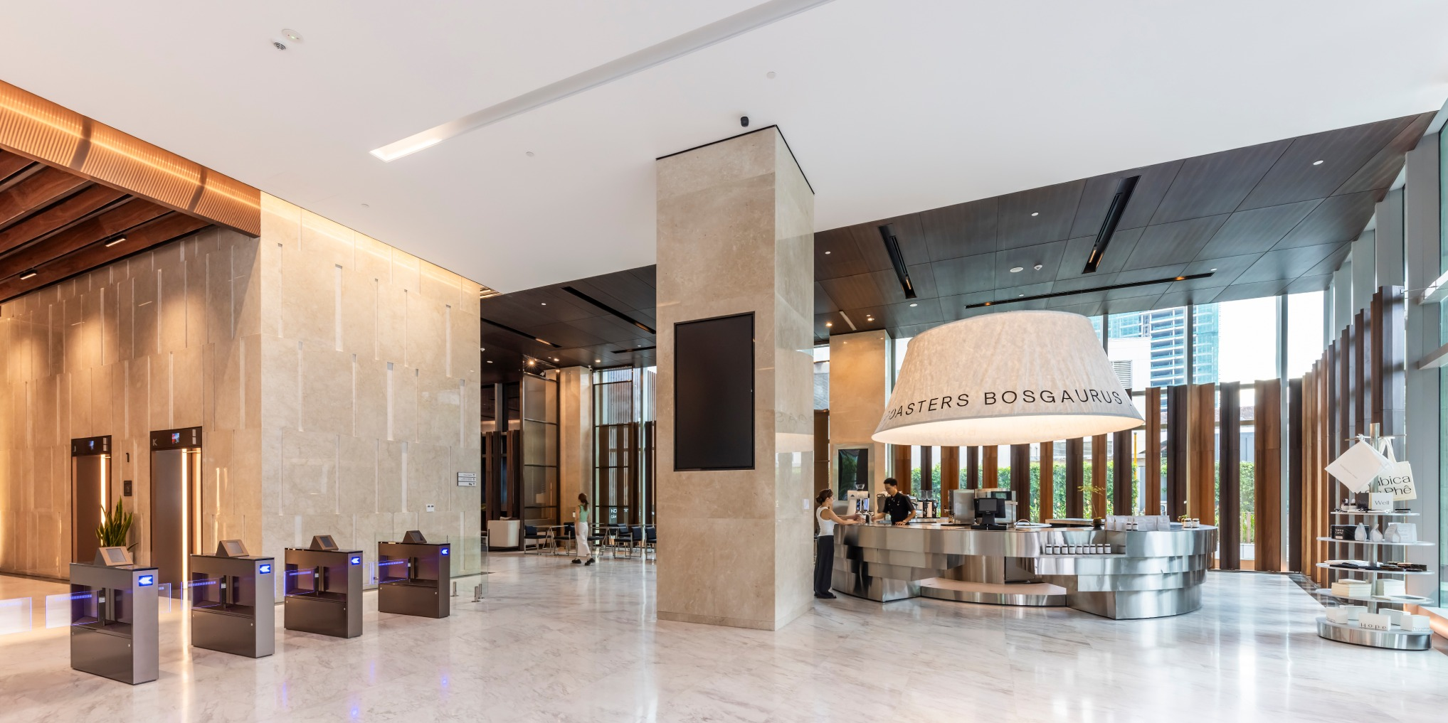 Spacious modern lobby with a prominent reception desk and marble features